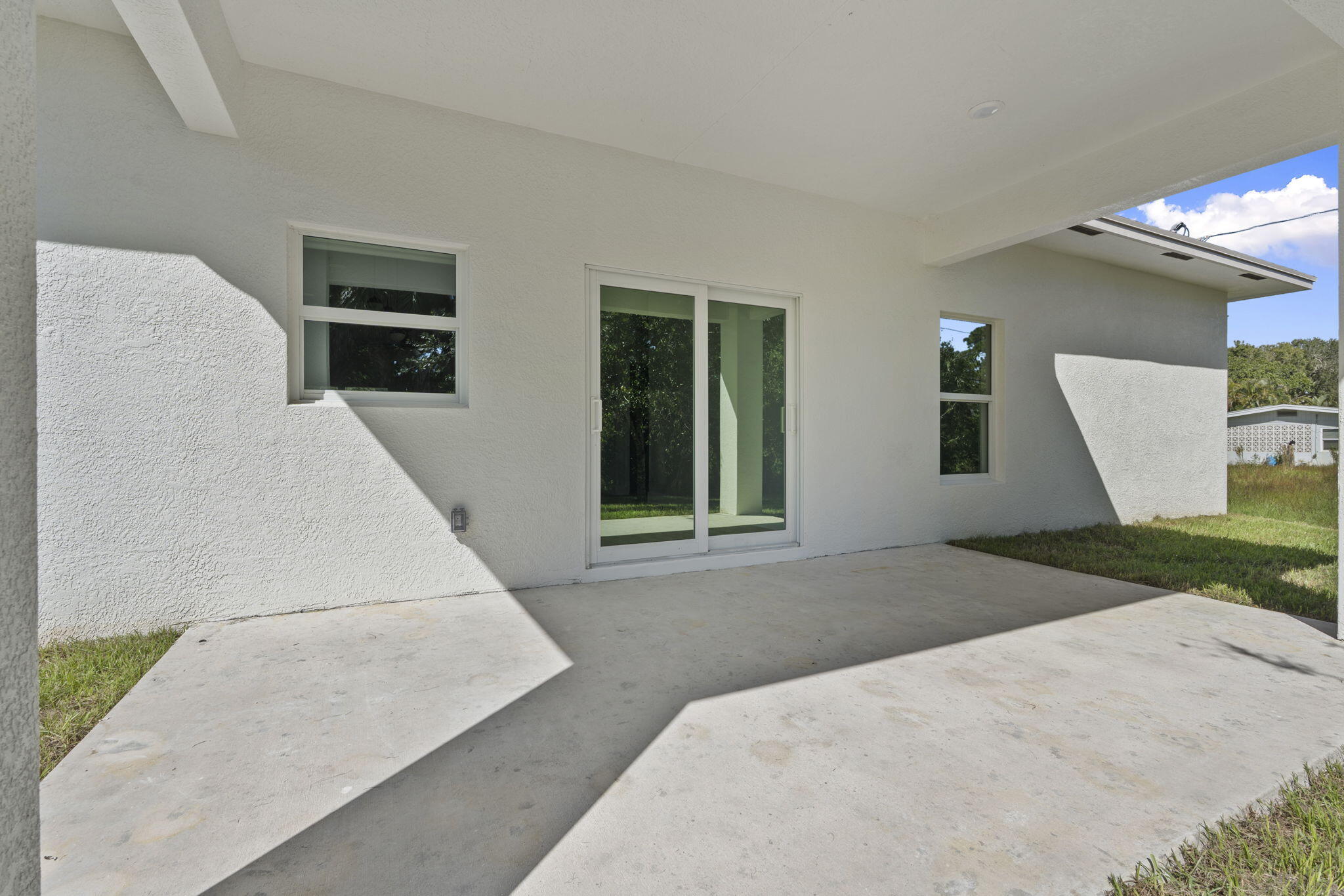 5310 Sunset Boulevard Fort Pierce, FL 34982 - Photo 36 of 39 a bedroom with a bed and a large window