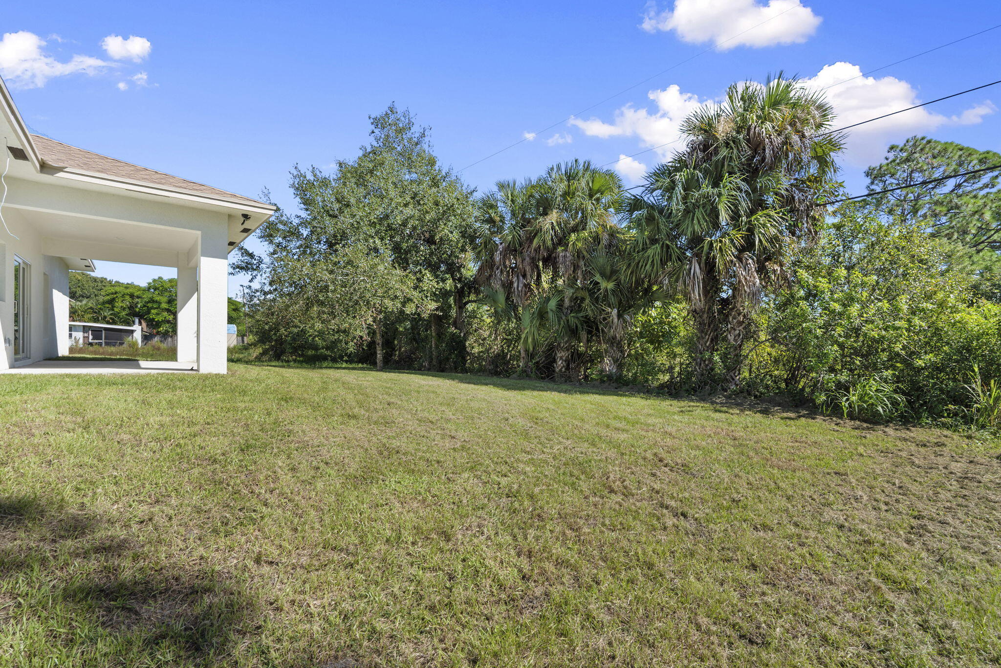 5310 Sunset Boulevard Fort Pierce, FL 34982 - Photo 37 of 39 a view of a yard with an trees