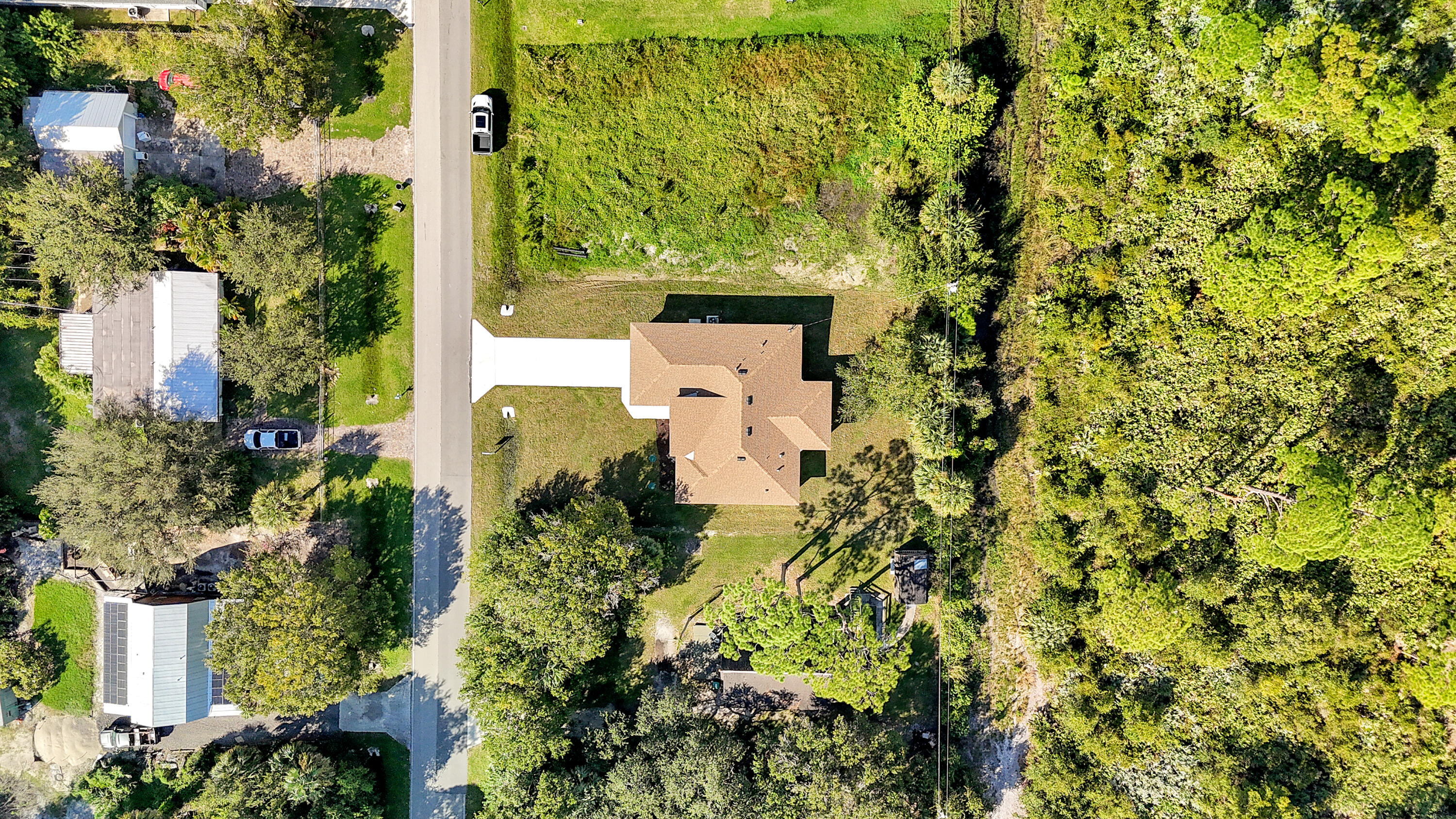 5310 Sunset Boulevard Fort Pierce, FL 34982 - Photo 6 of 39 an aerial view of a residential houses with yard