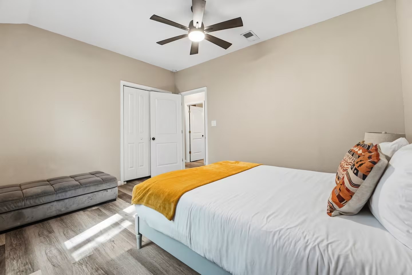 201 Winfield Thicket Road Bastrop, TX 78602 - Photo 20 of 36 a bedroom with a bed and a chandelier