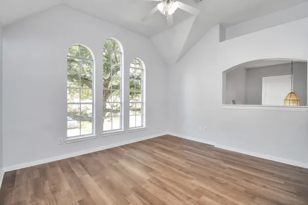 a view of an empty room with a window