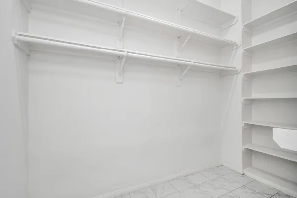 a view of an empty walk in closet