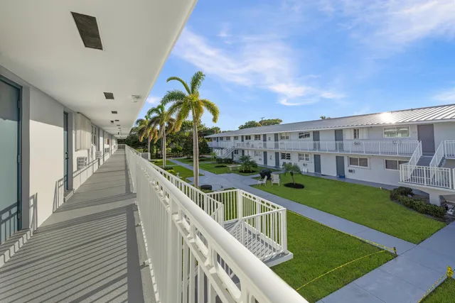 a swimming pool with outdoor seating and yard