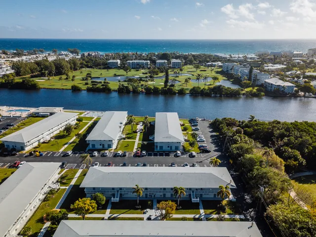 an aerial view of a house with a lake view