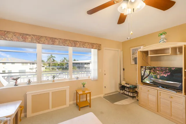 a kitchen with a sink appliances and cabinets