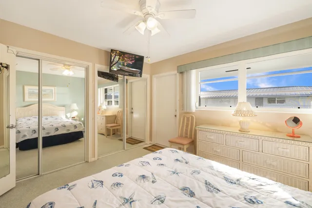 a bathroom with a sink mirror toilet and shower