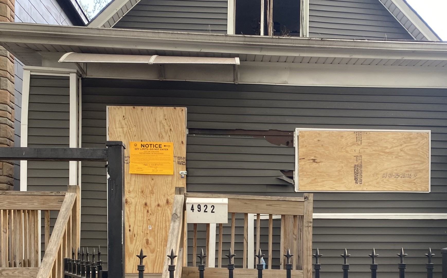 4922 West Ferdinand Street Chicago, IL 60644 - Photo 2 of 9 a view of a door of the house with a door and a window