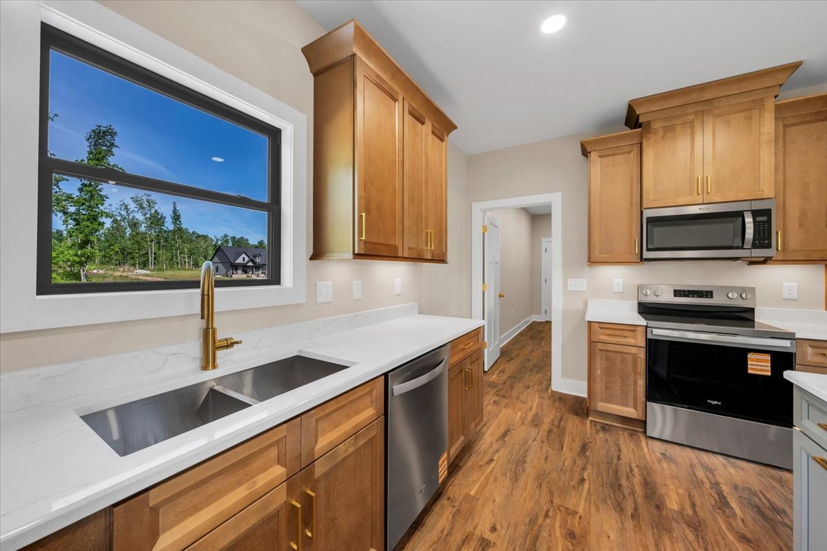 139 Brinkley Road Wartrace, TN 37183 - Photo 13 of 41 a kitchen with stainless steel appliances granite countertop a sink a stove and a refrigerator