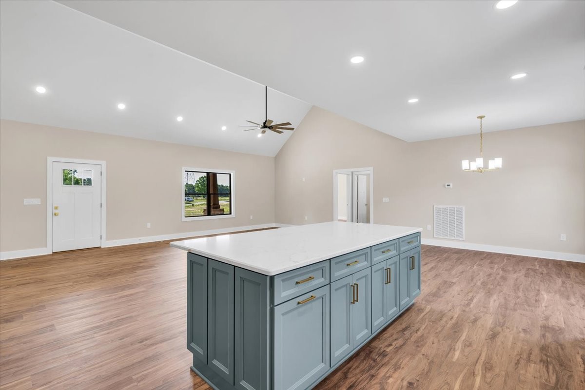 139 Brinkley Road Wartrace, TN 37183 - Photo 14 of 41 an open kitchen with a sink and wooden floor