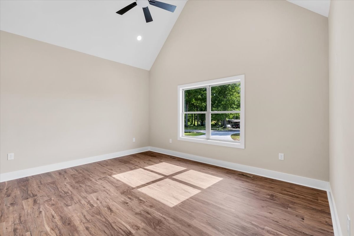139 Brinkley Road Wartrace, TN 37183 - Photo 15 of 41 an empty room with wooden floor cabinet and windows