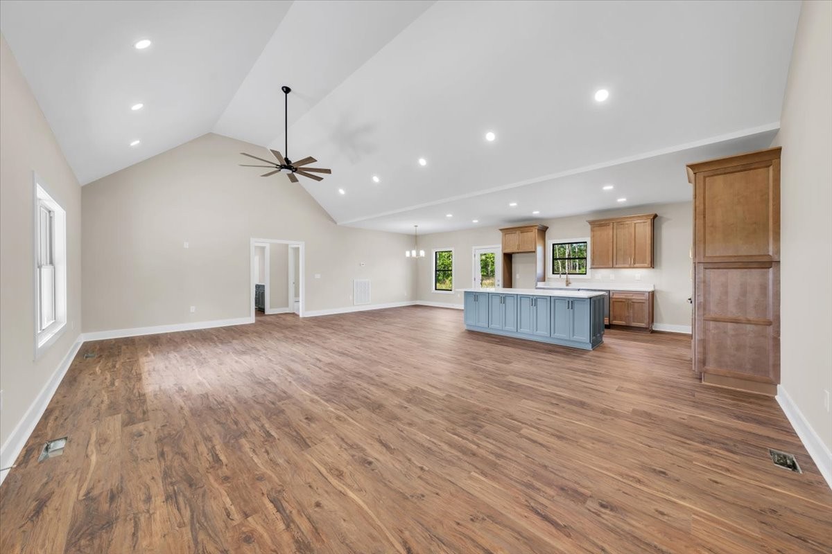 139 Brinkley Road Wartrace, TN 37183 - Photo 3 of 41 a view of a livingroom with wooden floor a ceiling fan and window