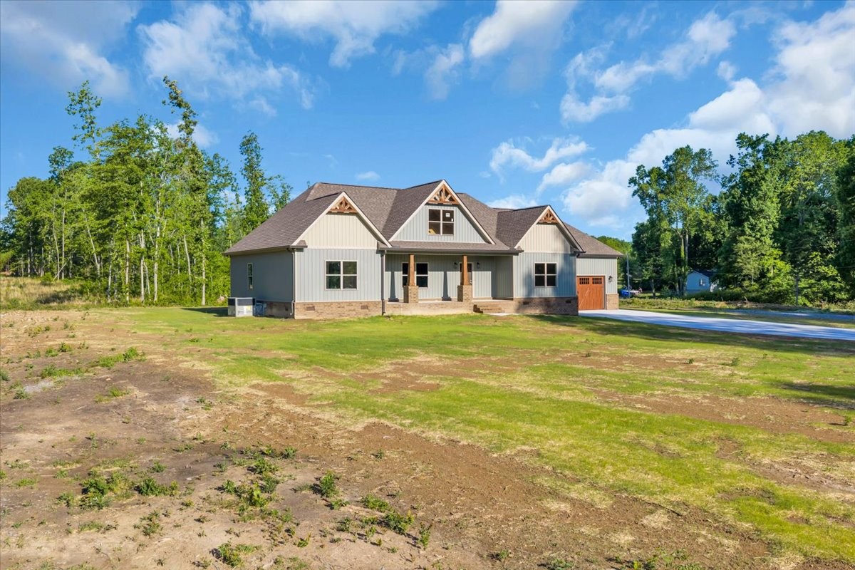 139 Brinkley Road Wartrace, TN 37183 - Photo 38 of 41 a front view of a house with a garden
