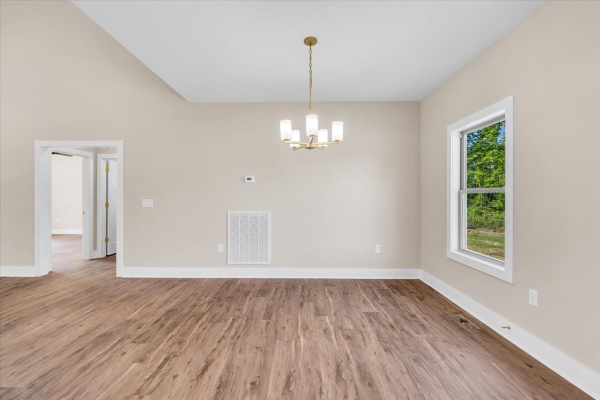 139 Brinkley Road Wartrace, TN 37183 - Photo 6 of 41 wooden floor in an empty room with a window