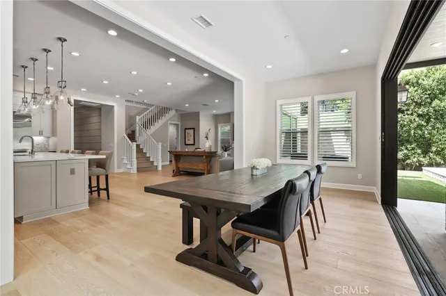 a spacious bedroom with a bed and a large window