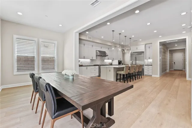 a spacious bedroom with a bed and a walk in closet