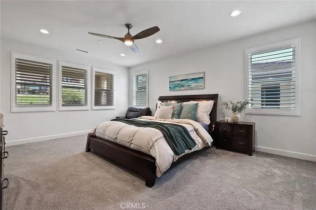 a kitchen with white cabinets and sink