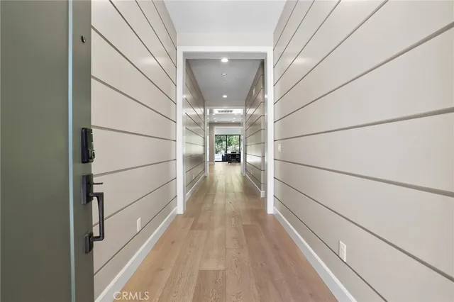 a view of gallery with wooden floor