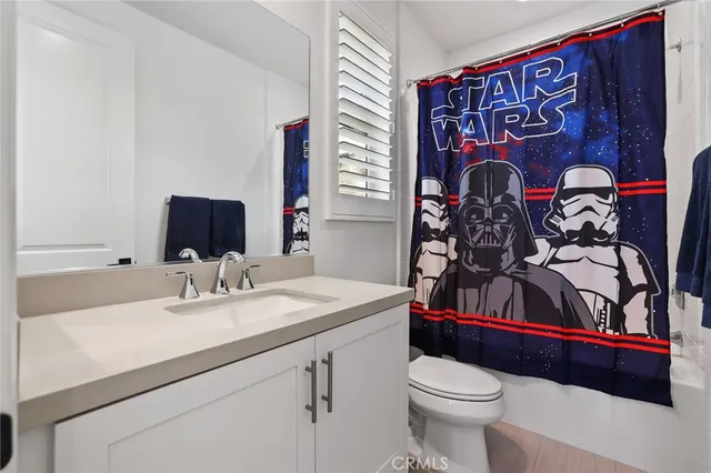 a view of a dining room with furniture wooden floor and a floor to ceiling window