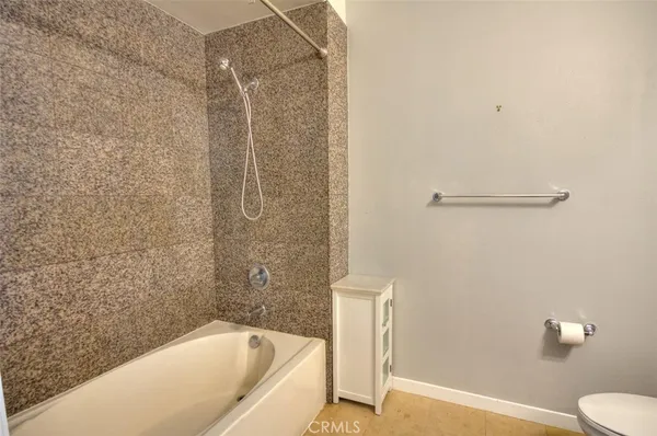 a bathroom with a bathtub and shower