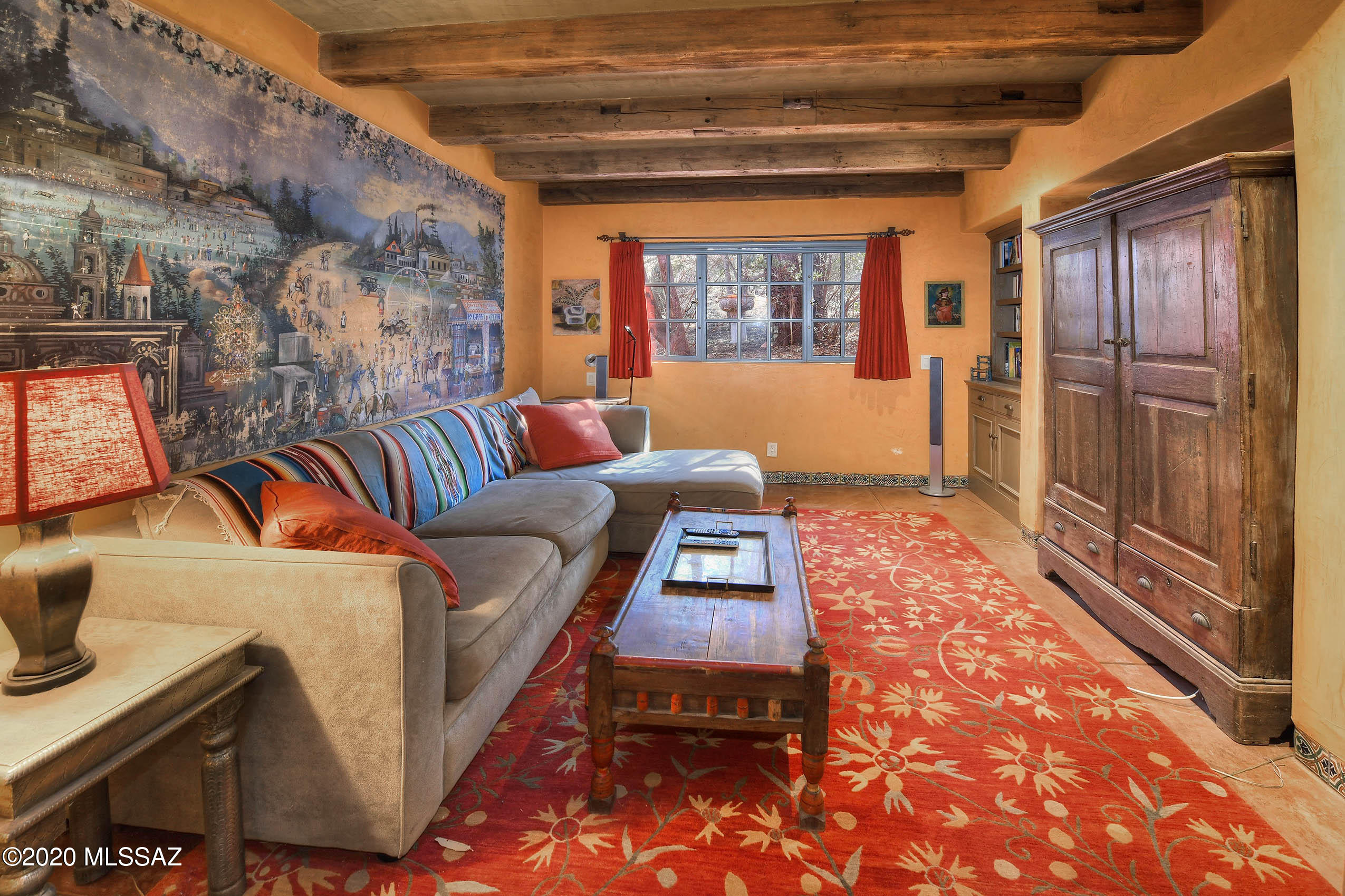360 Harshaw Creek Road Patagonia, AZ 85624 - Photo 23 of 50 a living room with furniture a rug and a window