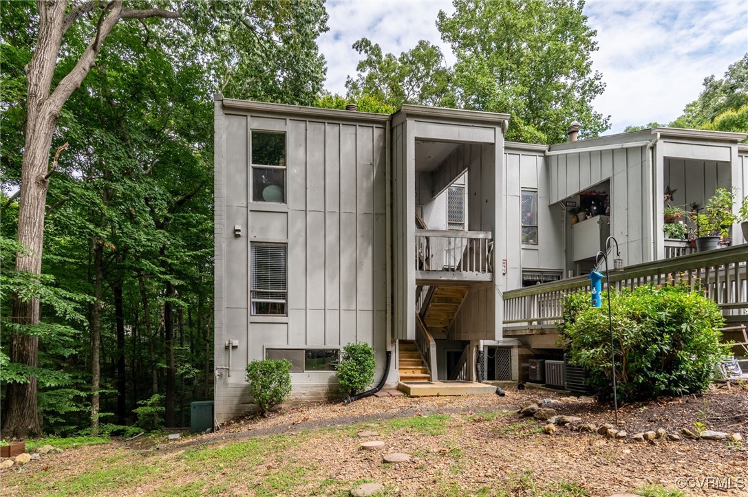 a view of a house with a yard and tree s