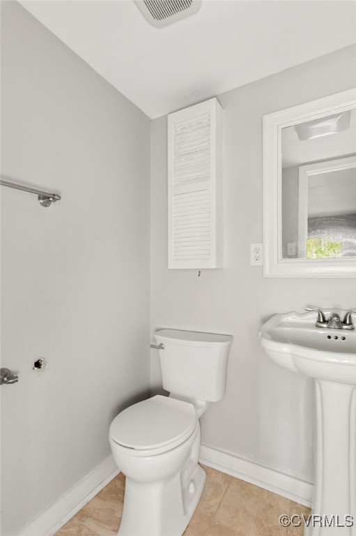 10174 Iron Mill Road North Chesterfield, VA 23235 - Photo 16 of 19 a bathroom with a toilet a sink and mirror