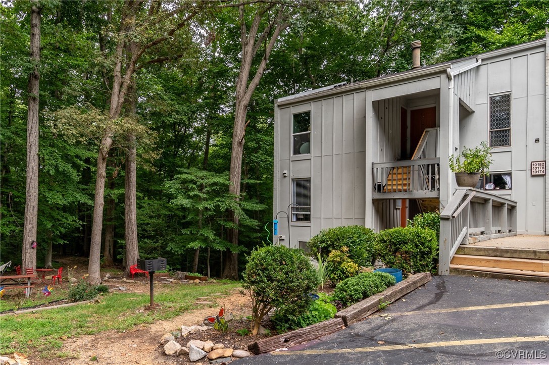 10174 Iron Mill Road North Chesterfield, VA 23235 - Photo 2 of 19 a view of a chair and table in backyard of the house