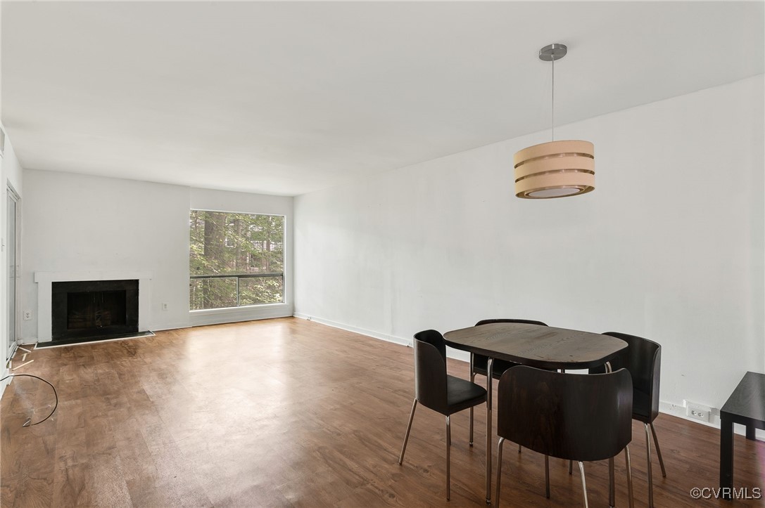 10174 Iron Mill Road North Chesterfield, VA 23235 - Photo 6 of 19 a view of a dining room with furniture and wooden floor