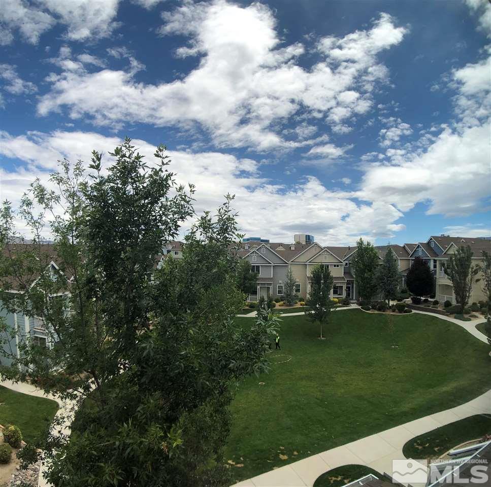230 Gramercy Lane Reno, NV 89509 - Photo 20 of 20 a view of a golf course with table chairs and a fire pit
