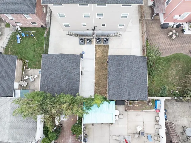 an aerial view of a city with lots of residential buildings