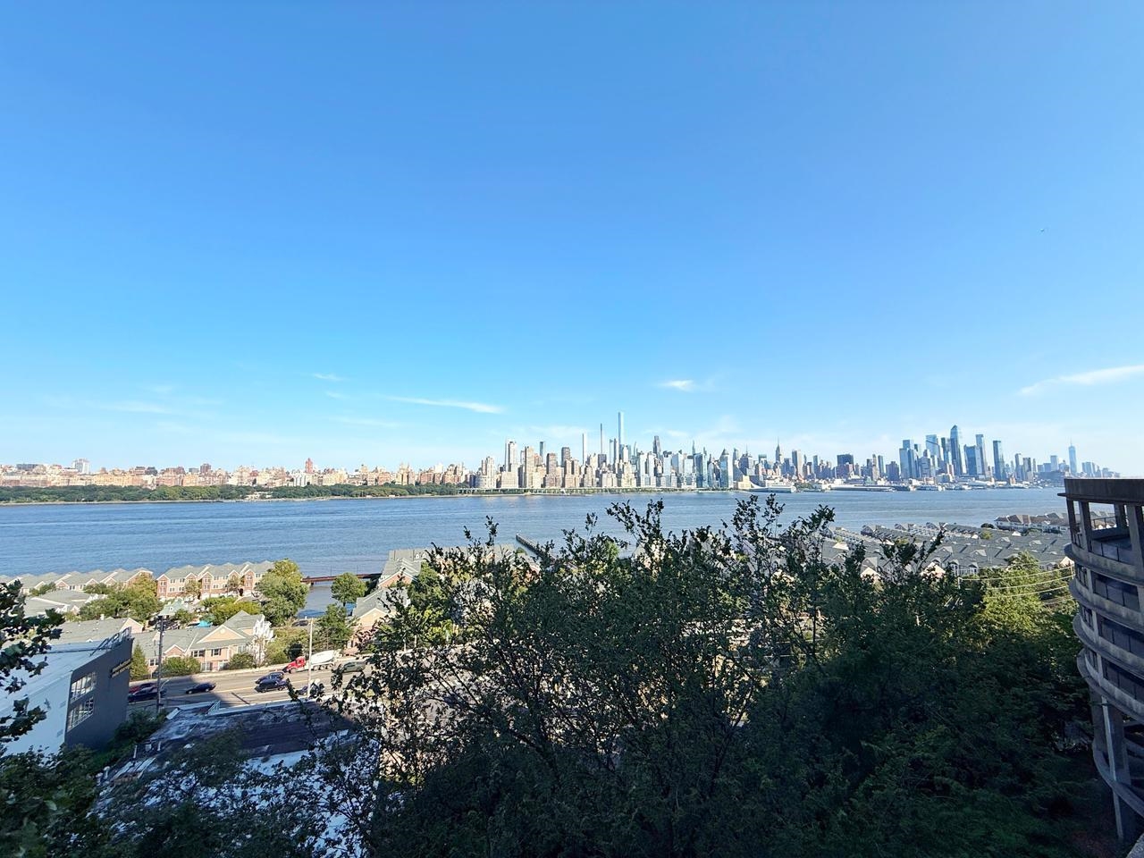 6600 Boulevard East, Unit 22B West New York, NJ 07093 - Photo 19 of 20 a view of a lake with houses in the back