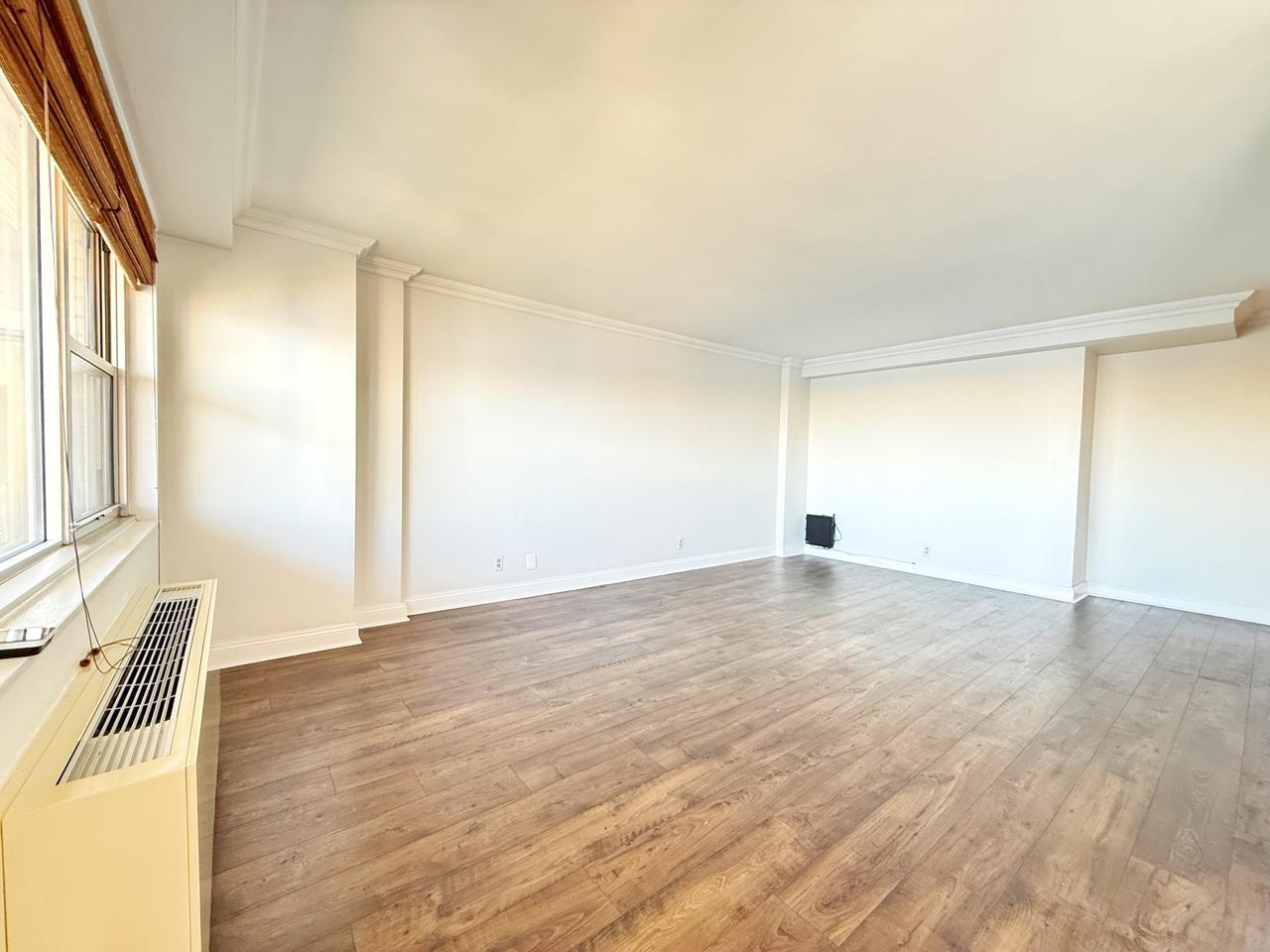 6600 Boulevard East, Unit 22B West New York, NJ 07093 - Photo 2 of 20 a view of empty room with wooden floor and fan