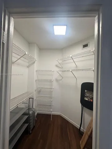 a view of a storage & utility room with racks on the wall