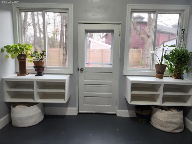a view of closet with wooden floor