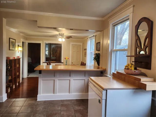 a kitchen with a sink and a refrigerator