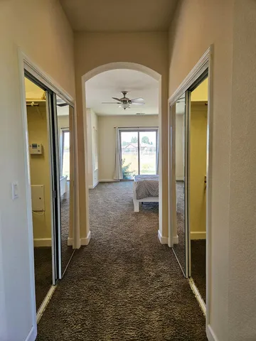 a bedroom with a bed and a couch