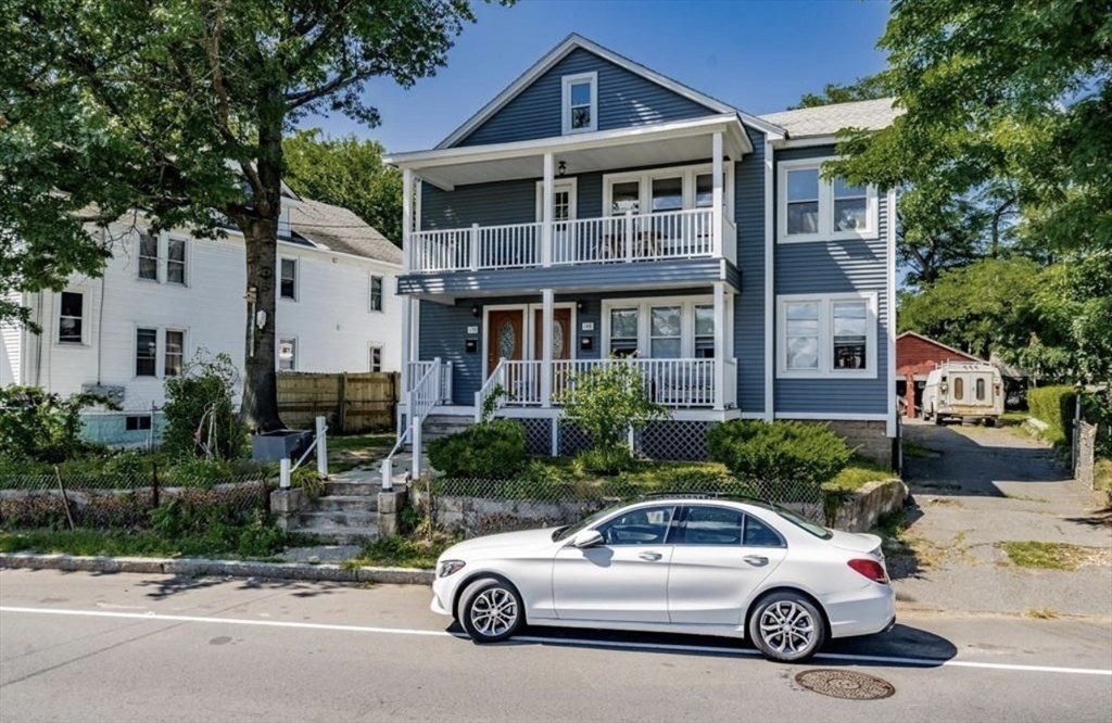 a car parked in front of a house