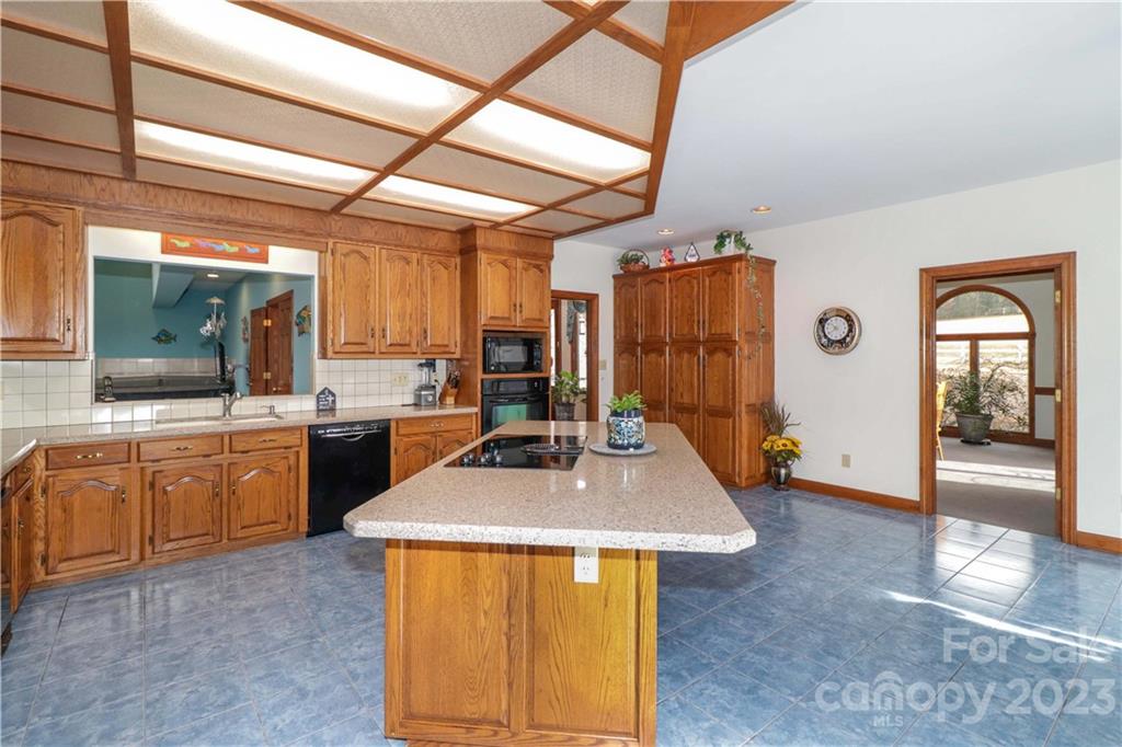 3449 Lee Moore Road Maiden, NC 28650 - Photo 23 of 48 a kitchen with sink refrigerator and window