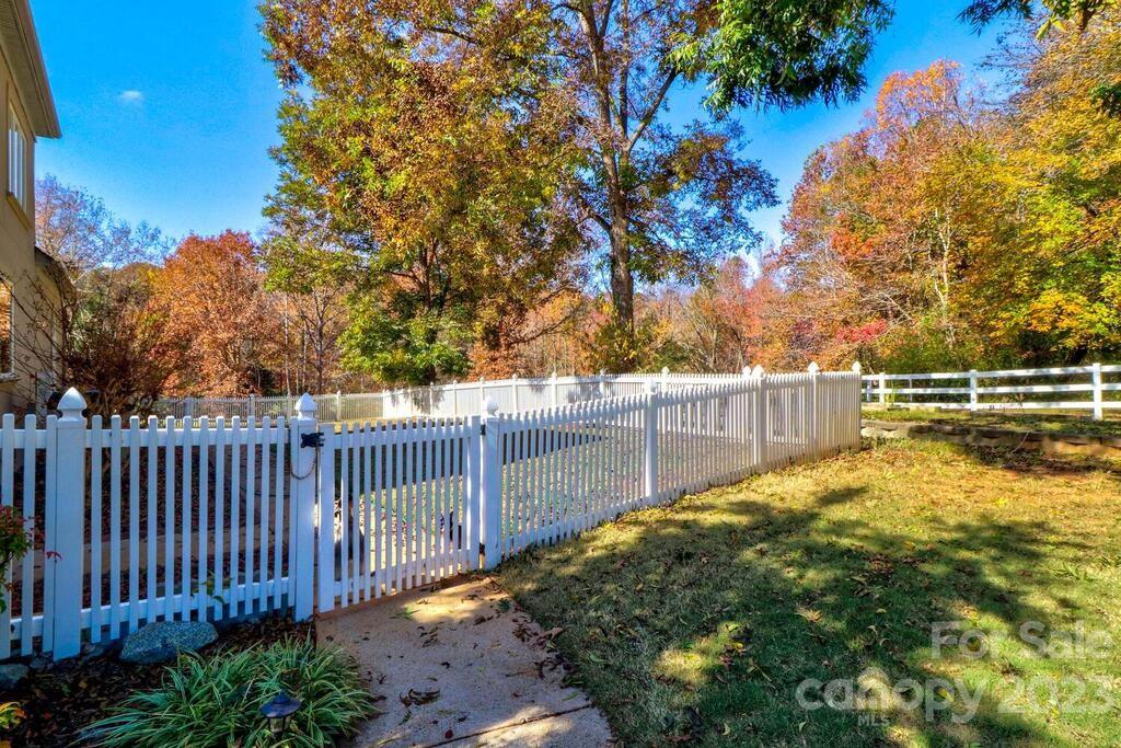 3449 Lee Moore Road Maiden, NC 28650 - Photo 8 of 48 a view of a backyard with wooden fence