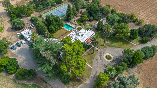 an aerial view of a house with a garden