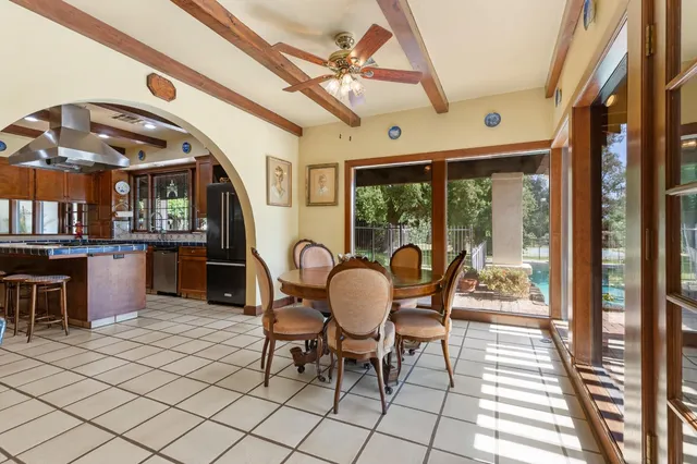 a dining room with furniture and window