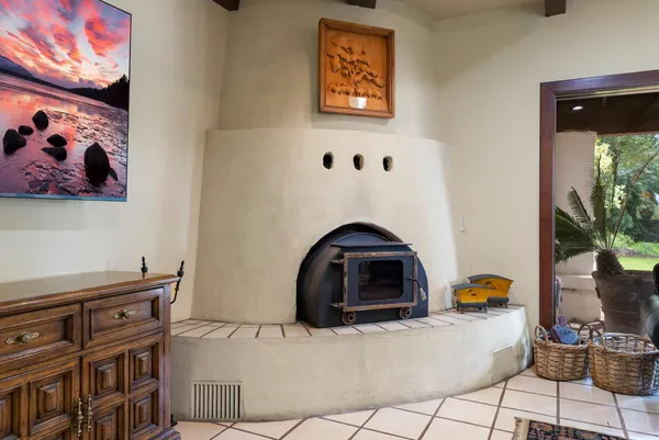 a living room with furniture a rug and a large window