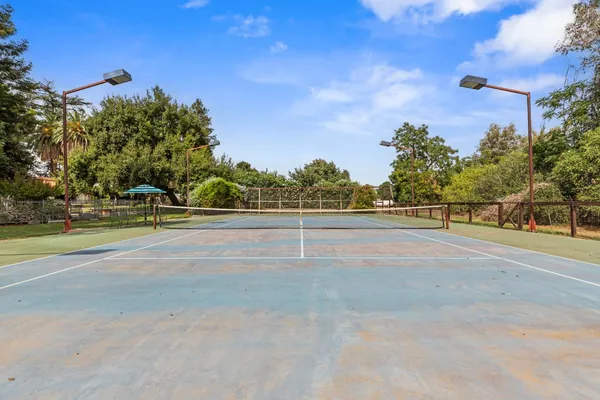a view of a swimming pool with chairs
