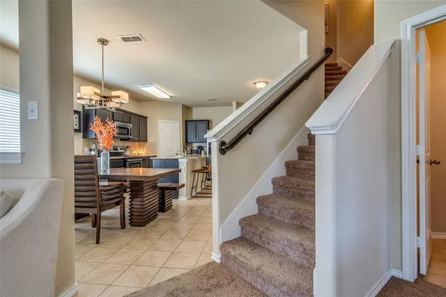 a view of entryway and kitchen