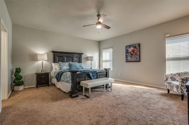 a bedroom with furniture and a window