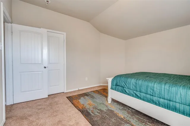 a room with a bed and a window