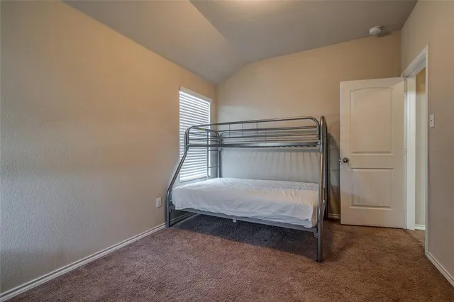 a room with bed and a window