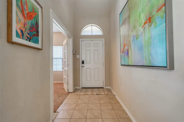 a view of an entryway with wooden floor