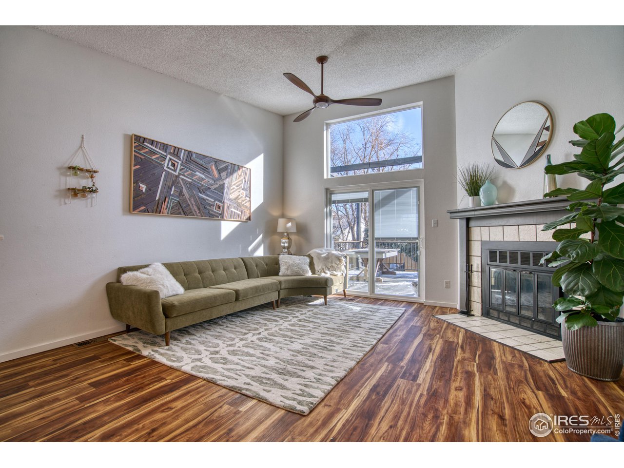 2154 Stuart Street Longmont, CO 80501 - Photo 2 of 27 a living room with furniture and a rug