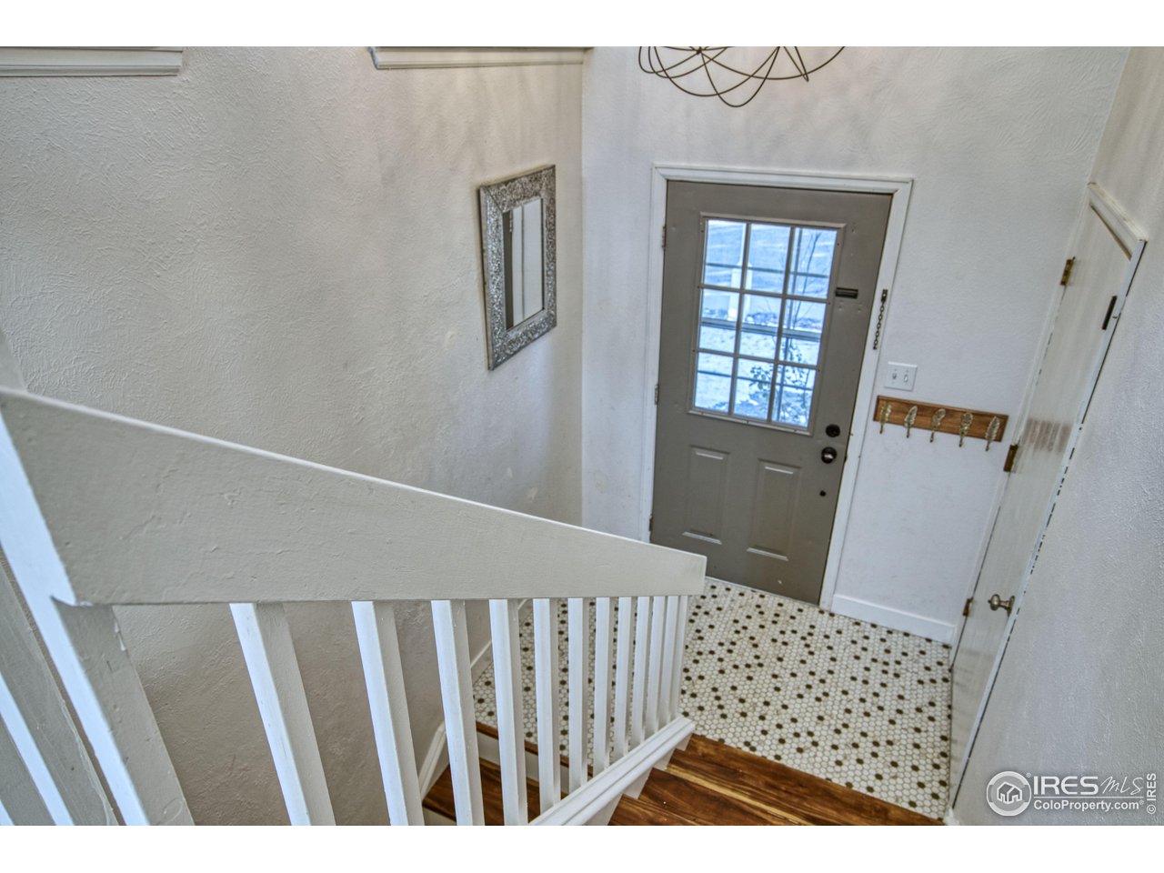 2154 Stuart Street Longmont, CO 80501 - Photo 24 of 27 a view of wooden floor in a corridor